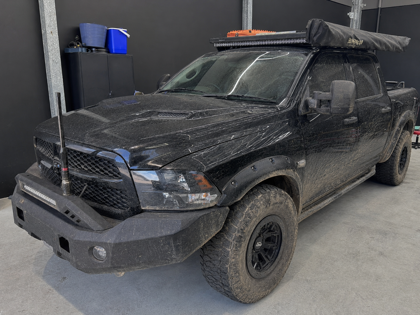 RAM 1500 before and after ceramic paint protection in workshop, before