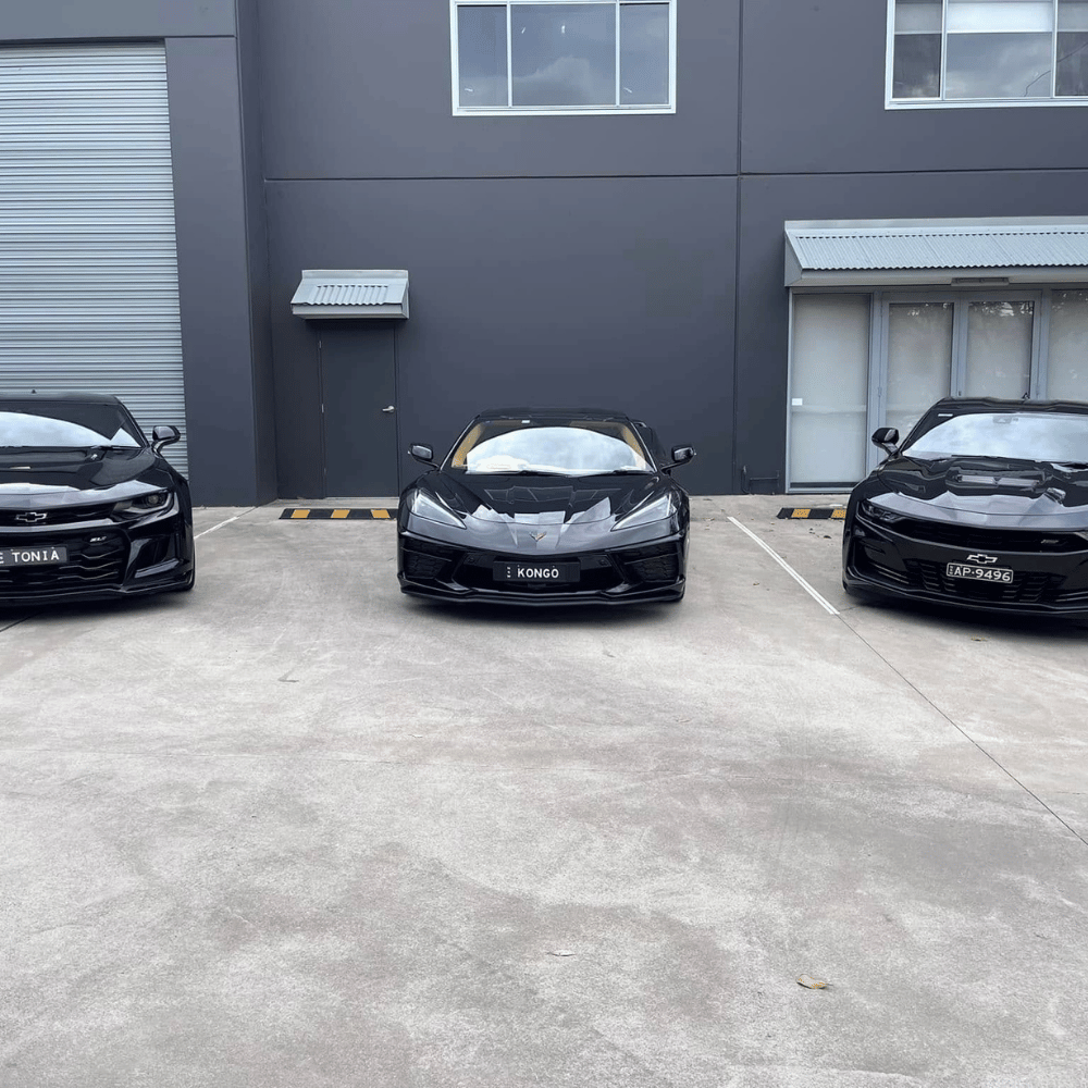 Black Chevrolet Corvette and Camaros with ceramic coating gloss finish